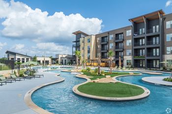 Resort-style swimming pool with sunning ledge